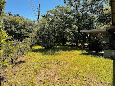 View of yard with view of scattered trees