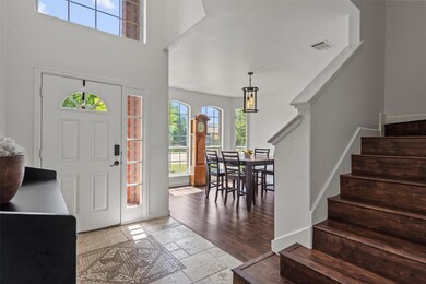Foyer featuring stone tile flooring, plenty of na