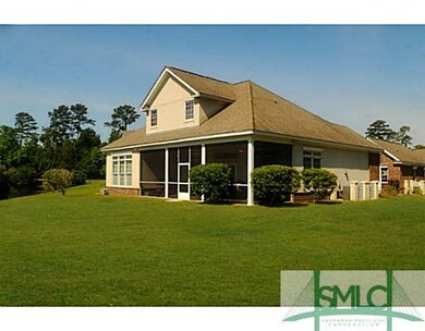 Exterior Back. Large screened porch overlooks nice