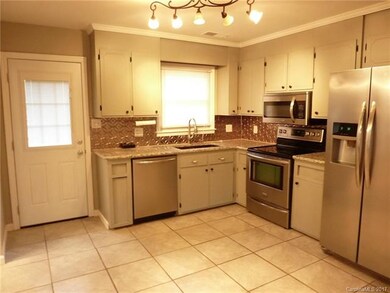 Updated Kitchen, Granite countertops, stylish back