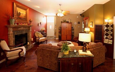 Warm and Inviting Living Room with a beautiful fireplace with gas logs.