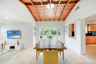 Dining room connects to family room and kitchen