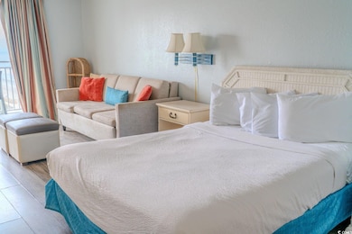 Bedroom featuring a textured wall and wood finishe