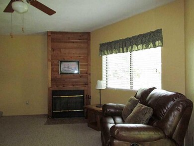 Living Room. It is a wood burning fireplace. Furni