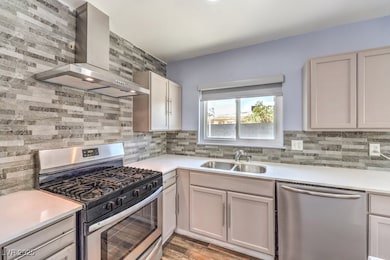 Kitchen with a sink, stainless steel appliances, d