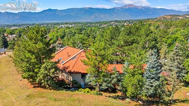 An aerial view from your private backyard reveals sweeping mountain vistas, offering a breathtaking backdrop of natural beauty and serenity.