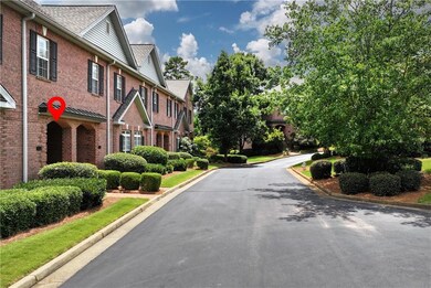 View of asphalt road featuring curbs