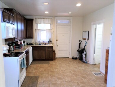 Open eat-in kitchen! Access to the deck and fenced back yard, too!