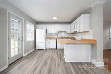 Kitchen Features New LVT Flooring and Back Deck Access