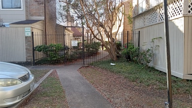 Walk up to the Pedestrian gate between Building A