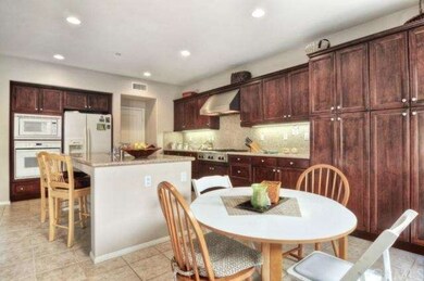 Inviting kitchen nook and open bar seating welcome