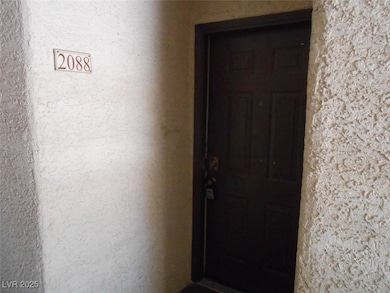 View of exterior entry featuring stucco siding