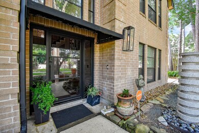 Entry features wide steel door with glass panes. N