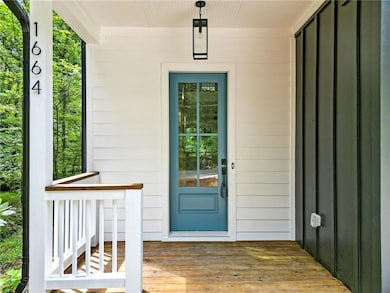 Doorway to property with a wooden deck