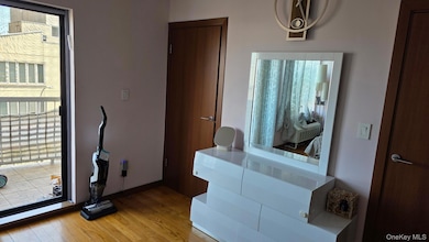 Bathroom featuring wood finished floors and baseboards