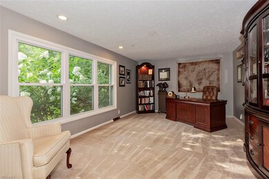 The formal living room offers lots of natural ligh
