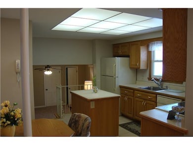 Kitchen. Nuetral tile floor enhances the natual be
