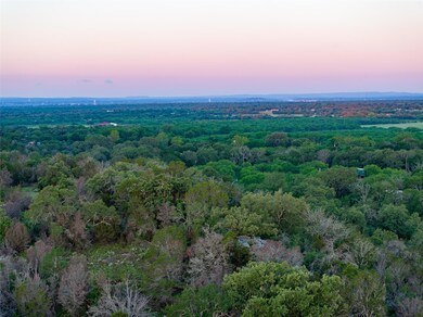 Aerial view of property's location featuring a fo