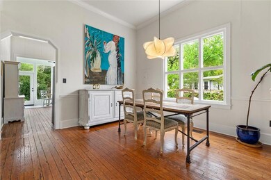 Dining room featuring crown molding, baseboards, a