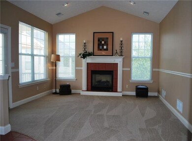 The freshly painted living room has new carpet, re