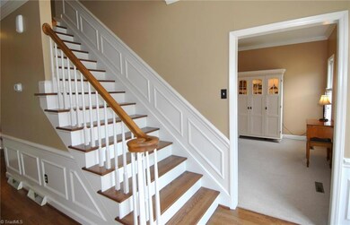Entry has beautiful hardwood floor, view into Living Room