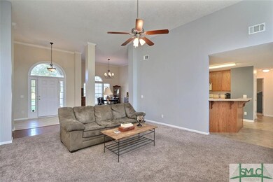 Great room open to front entrance, dining room, an