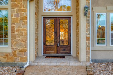 The double door stone entry features 8 foot doors