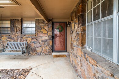 Covered porch with porch swing.