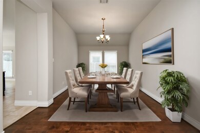 The formal dining room exudes sophistication, offering a perfect setting for intimate dinners and festive celebrations. With high ceilings and ample natural light, this space is both elegant and inviting.