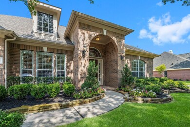 Double-stacked, stone flower bed borders containing established landscaping. This home has always had great curb appeal.