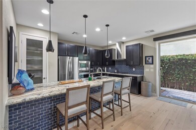 Kitchen featuring light stone countertops, visible