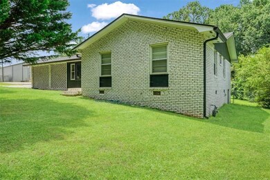 View of side of property featuring brick siding