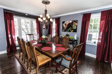 Large Dining Room filled with natural light.  Beau