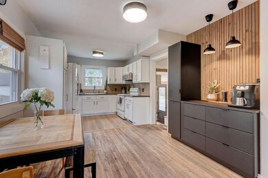 A built-in breakfast bar offers extra storage and a convenient dining spot.