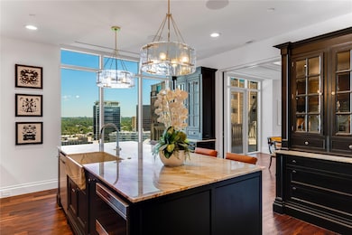 Kitchen with a notable chandelier, hanging light f