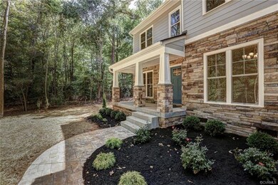Curved walkway and lush landscaping add great appe