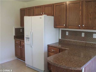Kitchen - Another view of kitchen cabinets and ref