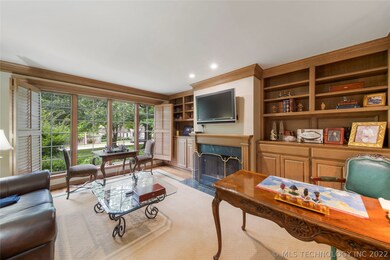 Library with Fireplace and wall of windows!