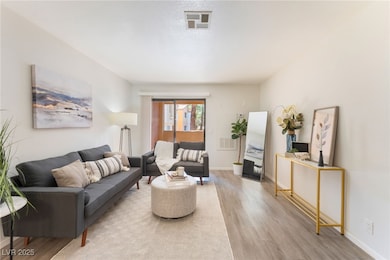 Living area with light wood finished floors
