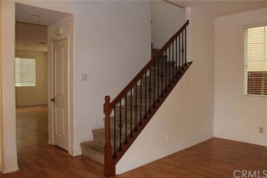 View from the front door of the stairs and hall to