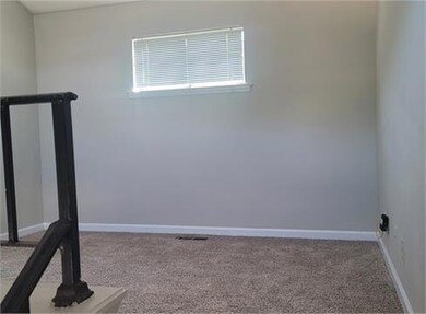 Spare room featuring carpet