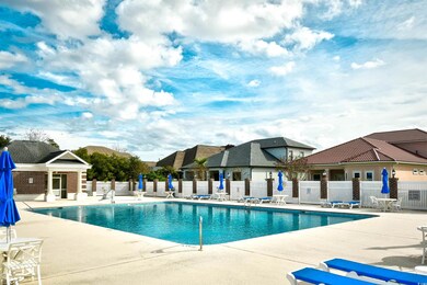 Community pool with a patio