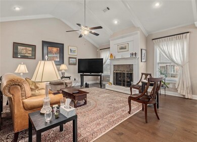 Living room is spacious and centered around a gas