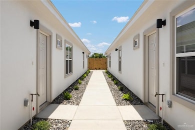 View of side of home featuring stucco siding