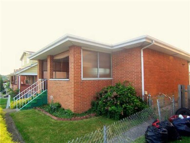 Exterior Front. The home has a fence surrounding t