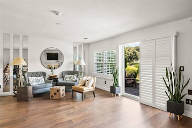 Sitting room featuring wood finished floors and baseboards