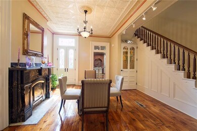 Formal dining room with decorative fireplace, fren
