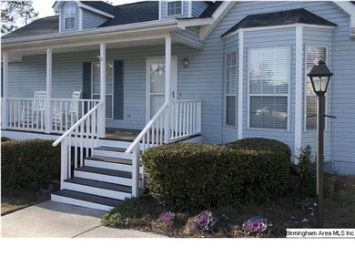 Relax and visit with neighbors on the welcoming fr