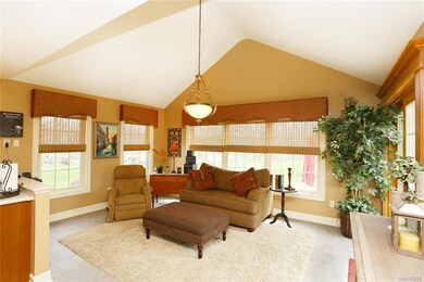 Spacious morning room overlooks and leads to the g