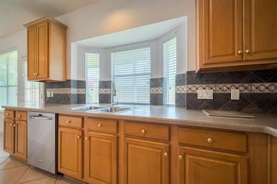 Spacious kitchen with a gas cooktop island and abu